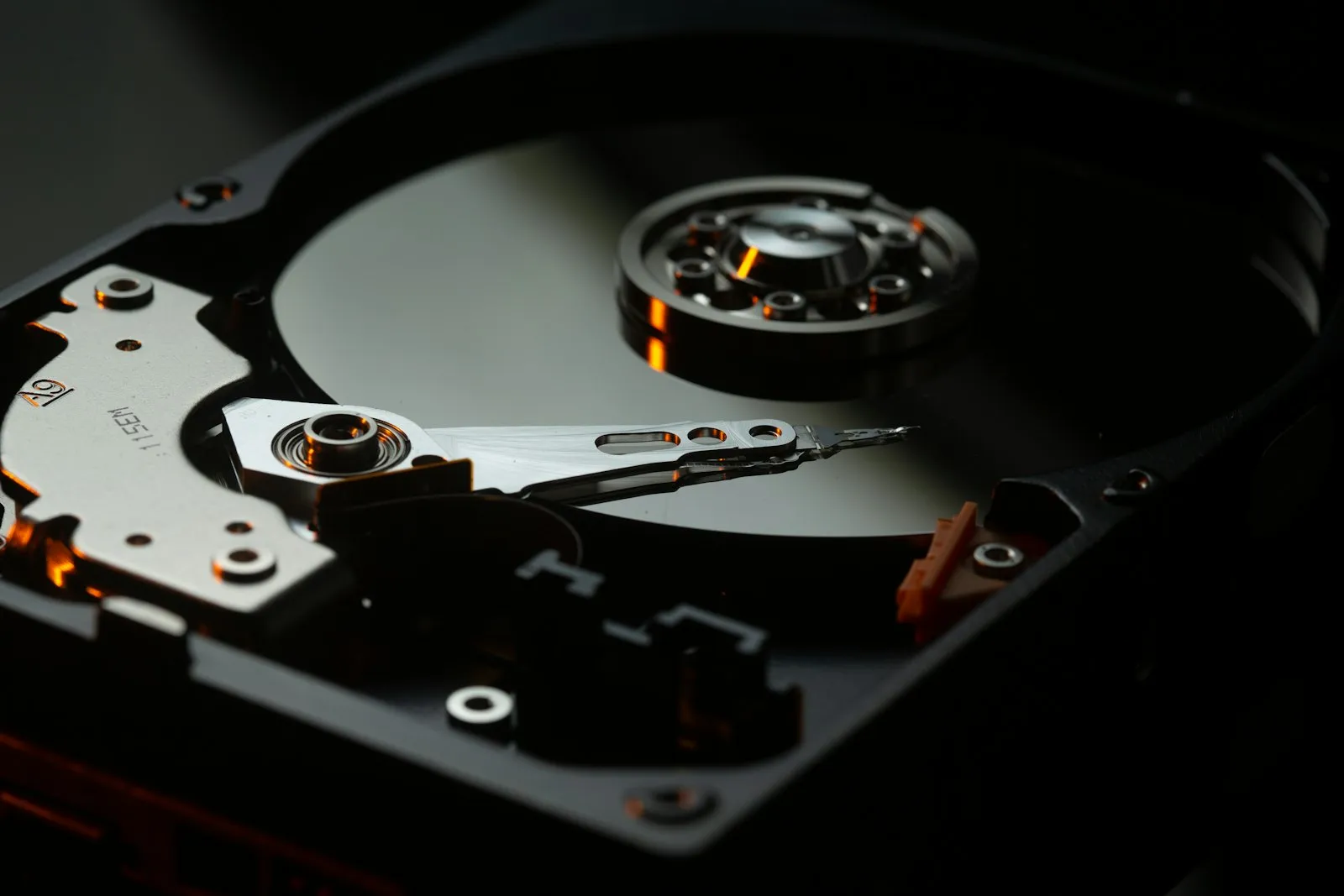 Macro photograph of a hard-drive platter and read arm